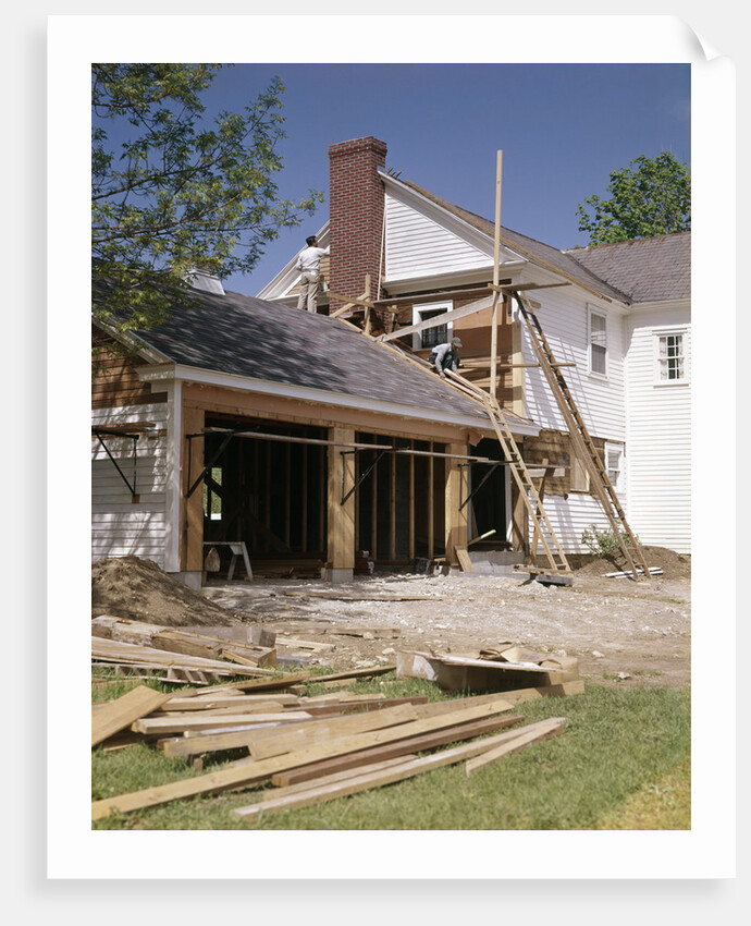 1960s 1970s workers building two car garage addition onto suburban home by Anonymous
