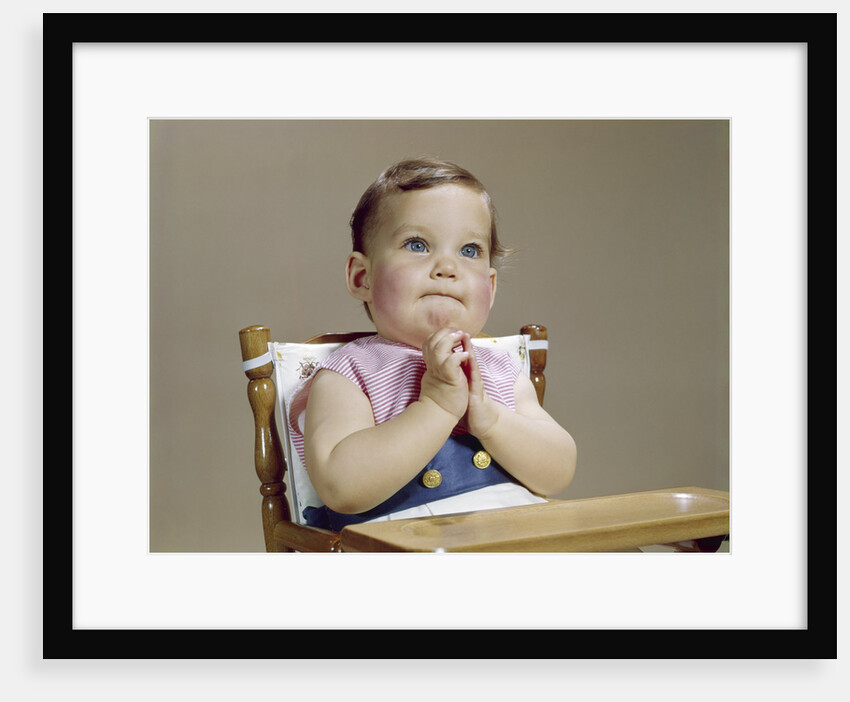 1960s baby hands together at chin thinking thoughtful facial expression by Anonymous