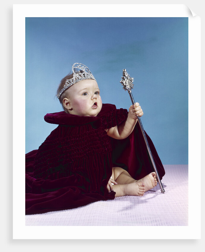 1960s baby dressed as royal queen in a velvet robe cloak cape rhinestone tiara crown and scepter wand by Anonymous