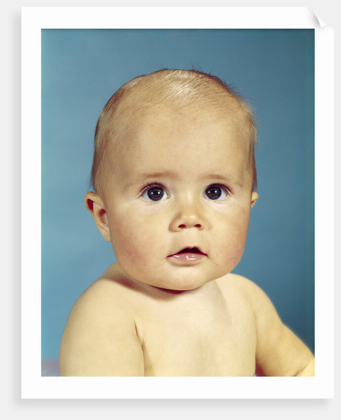 1960s portrait adorable sincere baby looking at camera by Anonymous