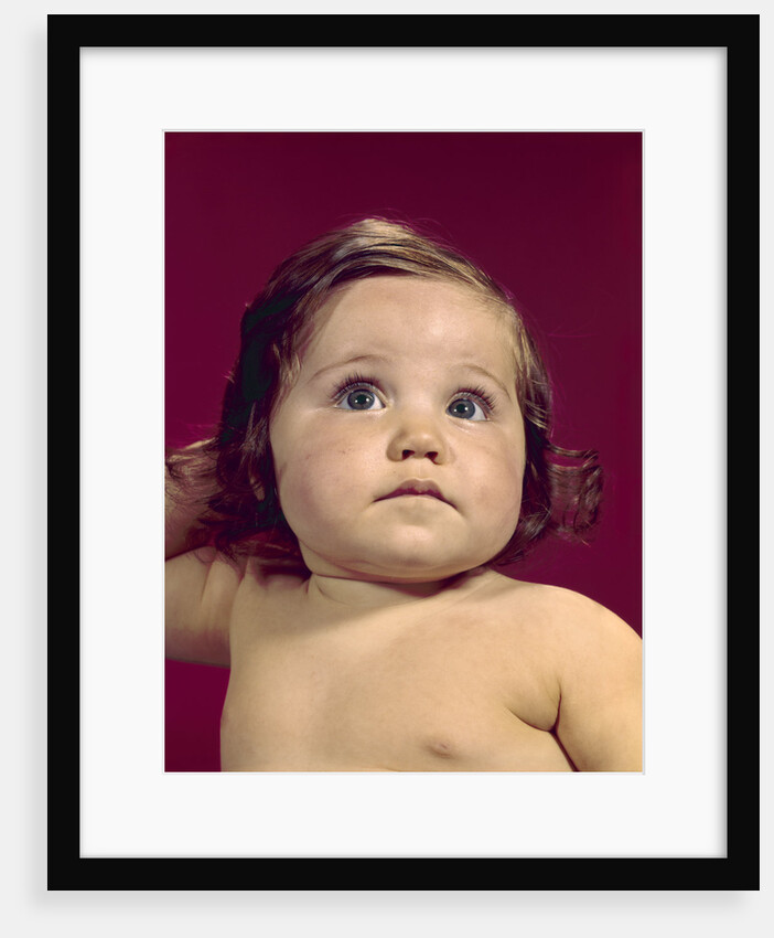 1960s portrait chubby cheeks big eyes brunette baby girl by Anonymous