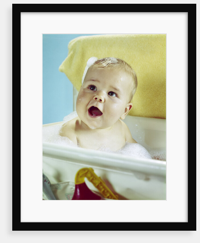 1960s happy baby taking bath by Anonymous