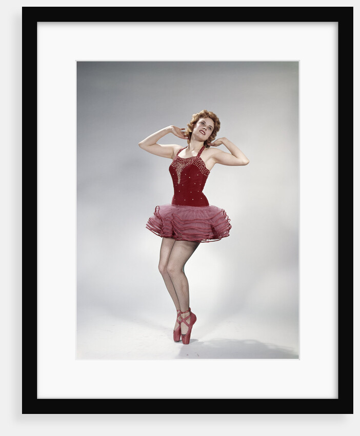 1960s teen girl woman red velvet costume pink net tutu fishnet stockings dance pose en pointe by Anonymous