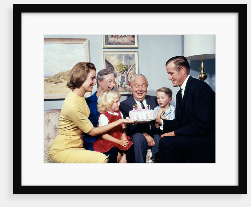 1960s three generation family with birthday cake by Anonymous