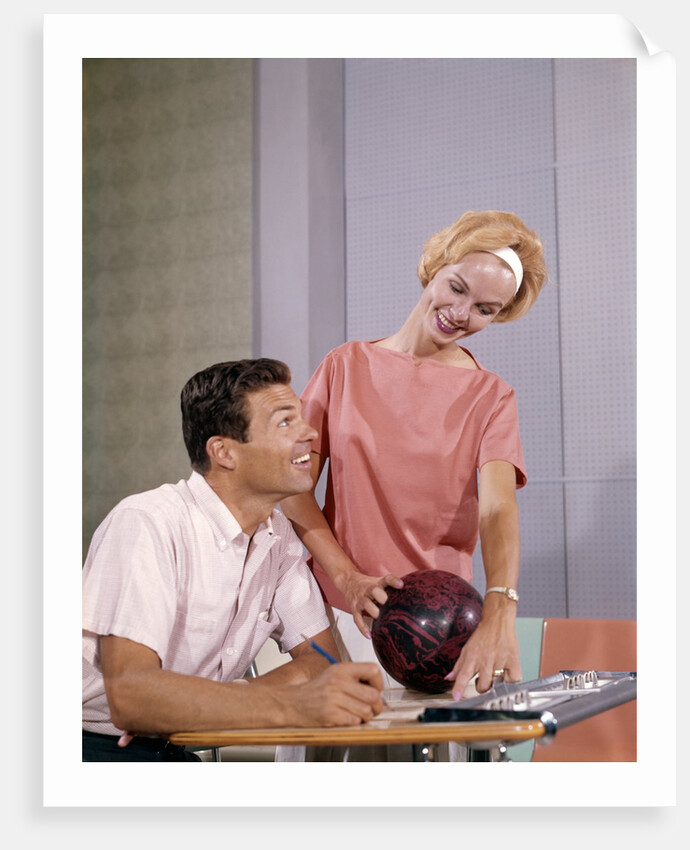 1960s couple husband wife bowling checking the score indoor by Anonymous