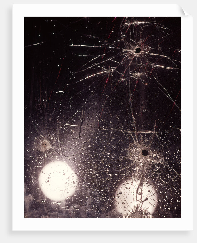 1970s bullet holes and raindrops on shattered glass windshield by Anonymous