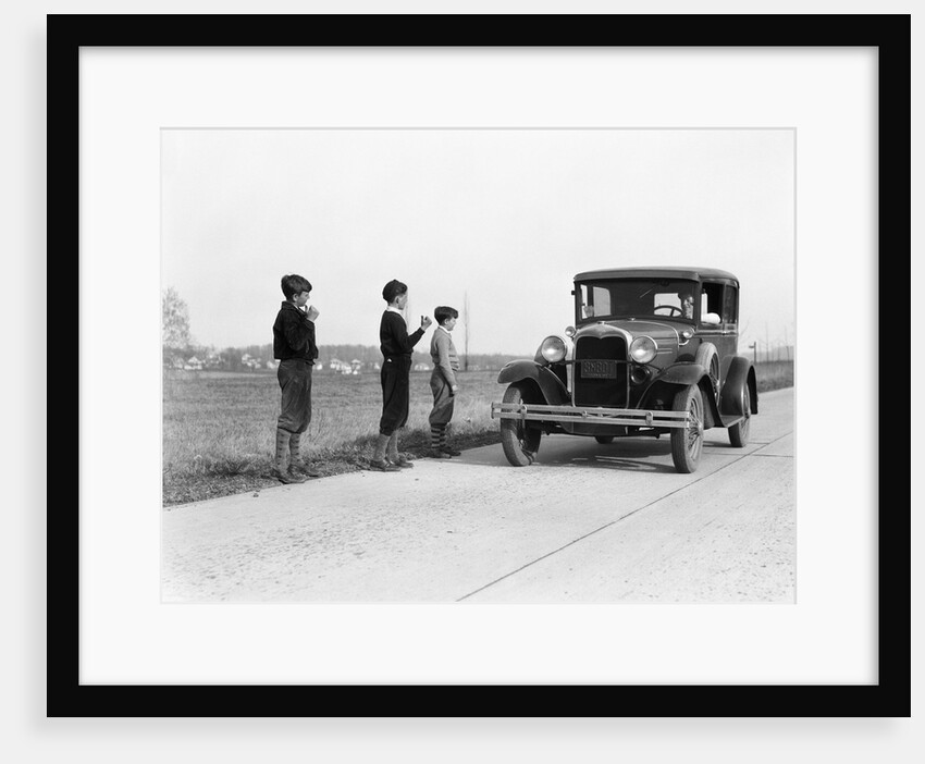1930s 1920s man driving ford model a car 3 boys hitchhiking by Anonymous