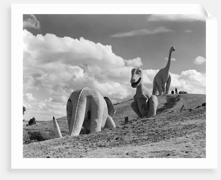 1950s dinosaur park south dakota three dinosaur statues on hillside by Anonymous