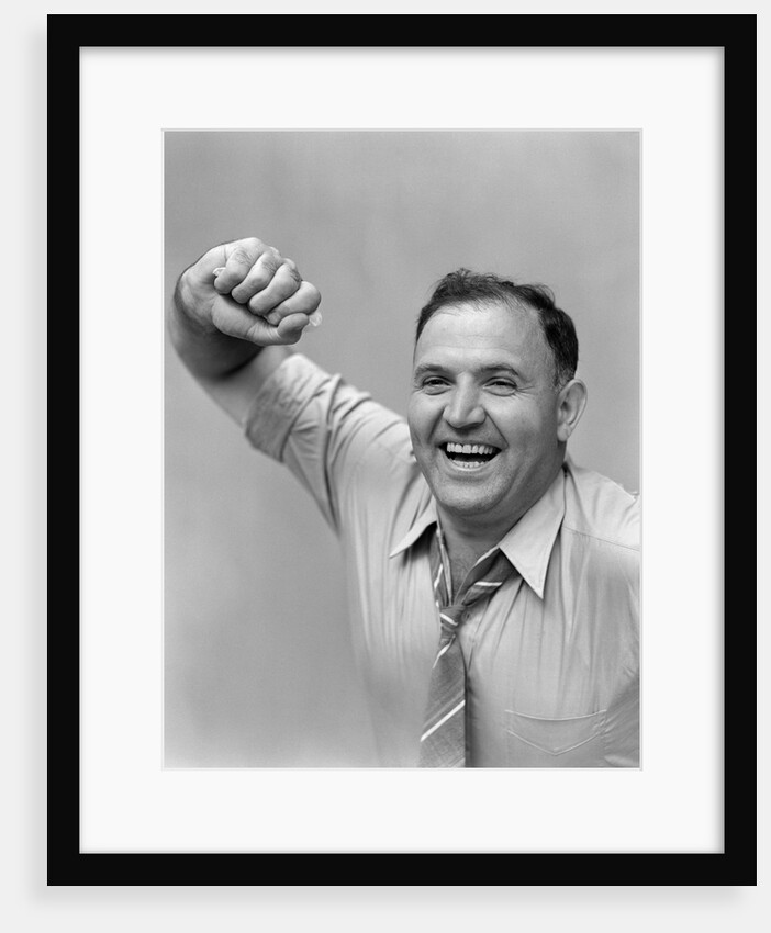 1940s 1950s portrait of man in shirt and tie holding handkerchief smiling by Anonymous