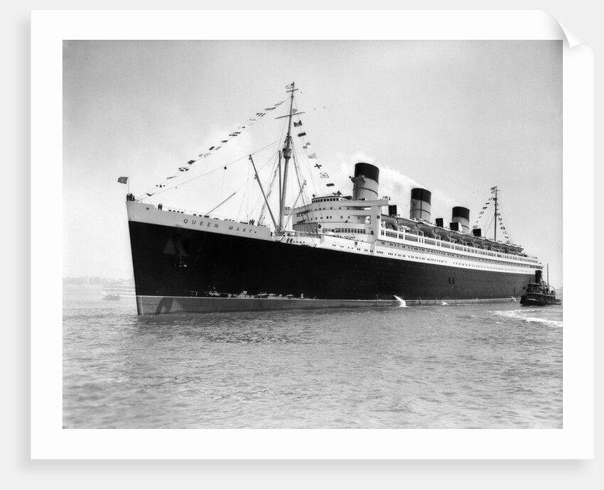 1930s 1936 maiden voyage of queen mary dwarfing small tugboat moving alongside it by Anonymous