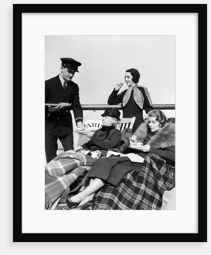 1930s 1920s three women being served tea by a steward on board an ocean liner crossing the atlantic ocean by Anonymous