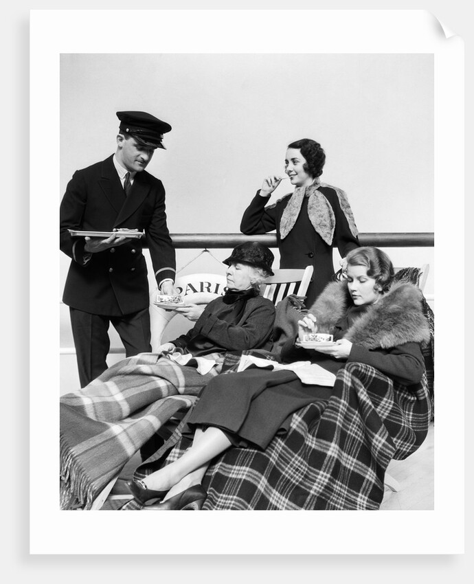 1930s 1920s three women being served tea by a steward on board an ocean liner crossing the atlantic ocean by Anonymous