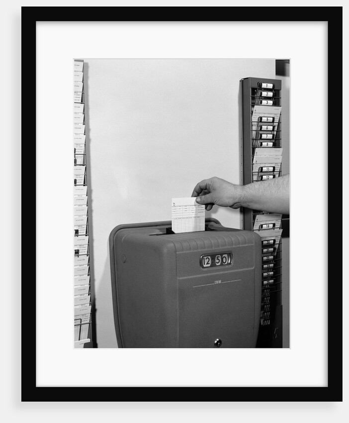 1950s man's hand punching time card by Anonymous