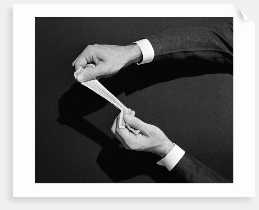 1930s 1940s man's hands symbolic money stretching a dollar by Anonymous