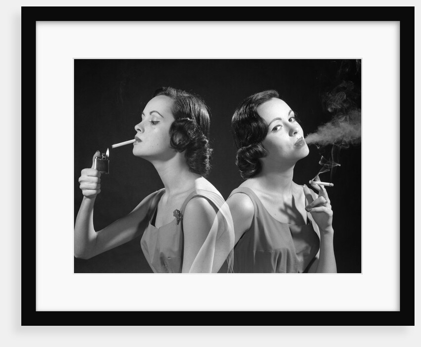 1960s multiple exposure two views brunette woman smoking a cigarette lighting it and exhaling smoke by Anonymous