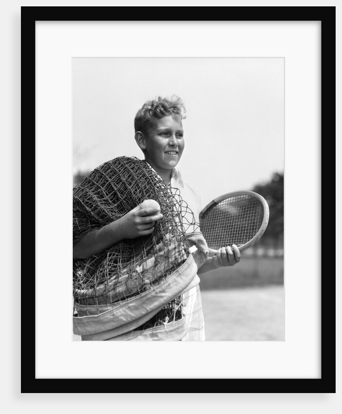 1920s 1930s boy tennis player holding racket net and ball by Anonymous