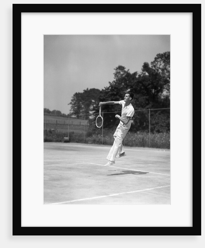 1930s man playing tennis jumping mid air action by Anonymous