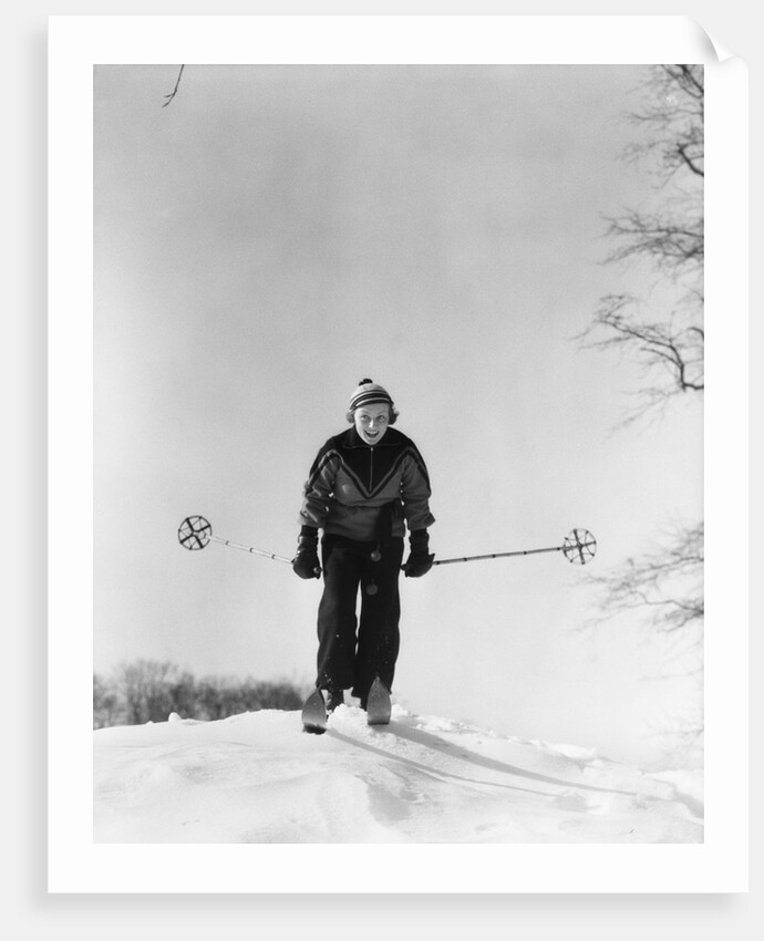 1930s woman holding ski poles skiing in snow by Anonymous