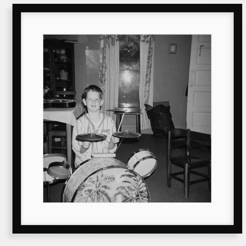 Ten year old boy on drum set, ca. 1969. by Anonymous