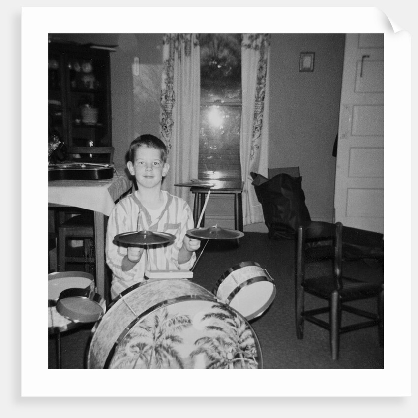 Ten year old boy on drum set, ca. 1969. by Anonymous