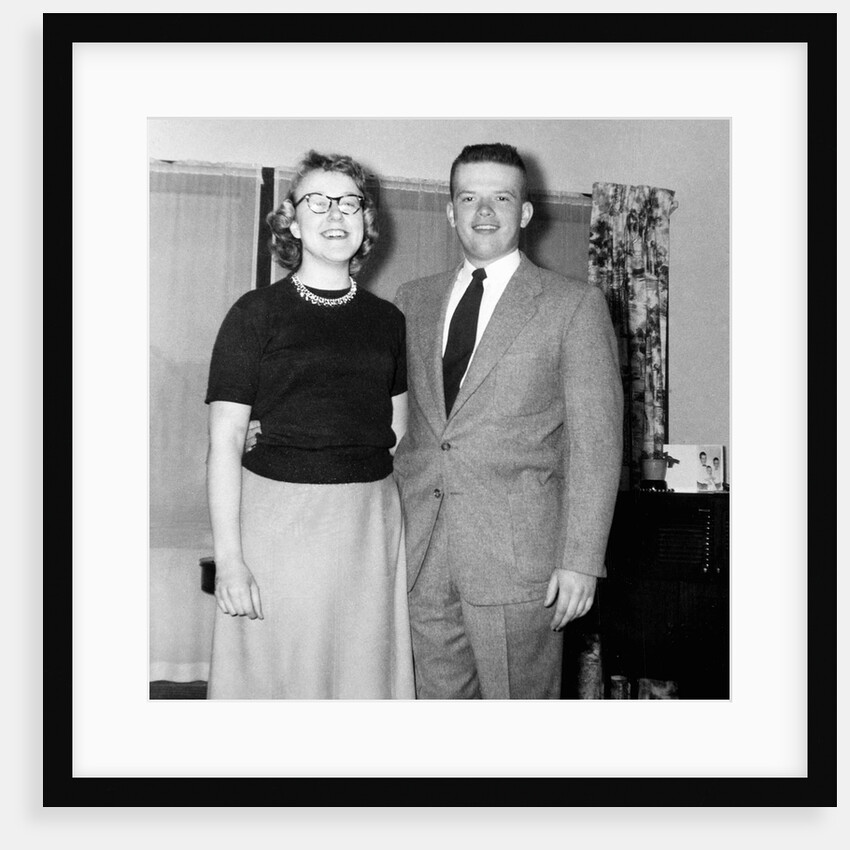 Young newlyweds smile for a portrait, ca. 1956. by Anonymous