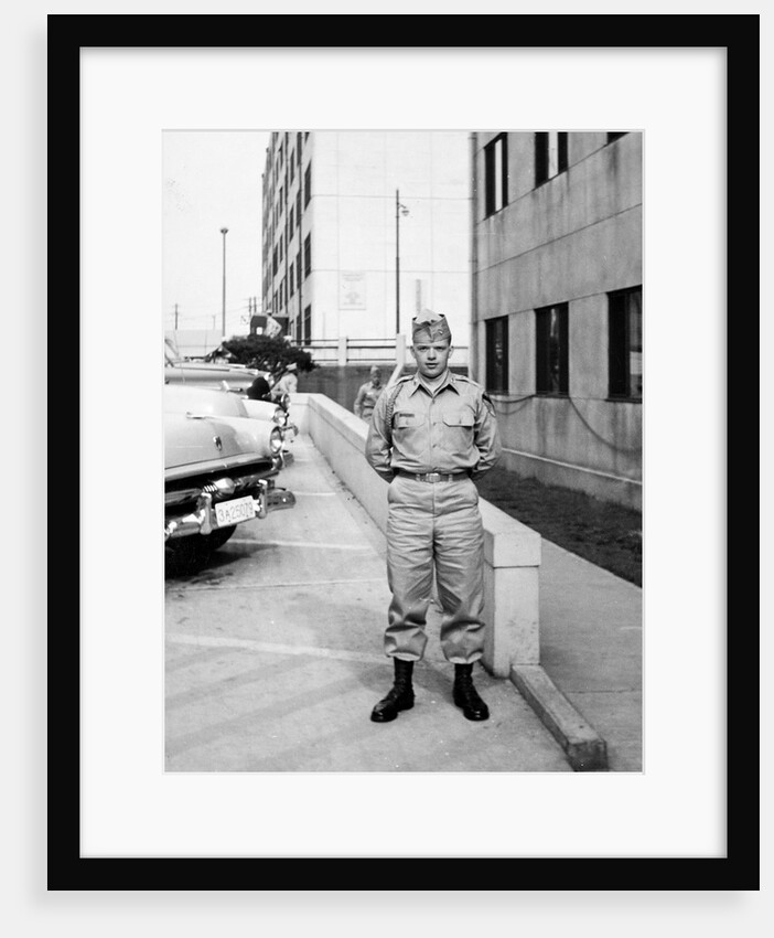 US army soldier poses for a photo on base, ca. 1954. by Anonymous