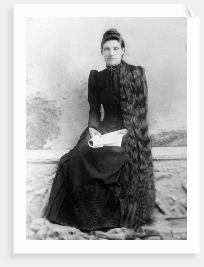 Young woman with long hair portrait, ca. 1900. by Anonymous