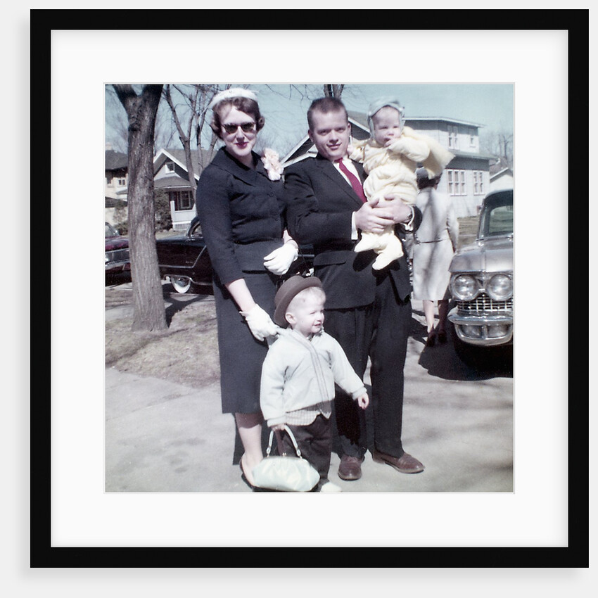 Young family dressed in the Sunday best, ca. 1960. by Anonymous