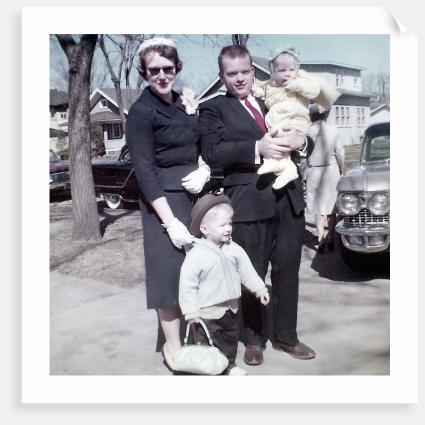 Young family dressed in the Sunday best, ca. 1960. by Anonymous
