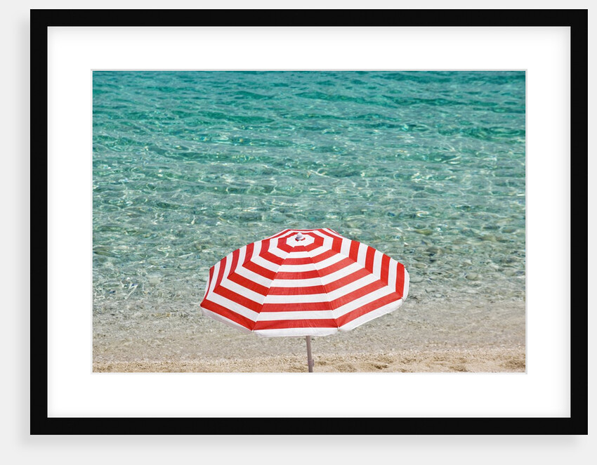 Close up of striped beach umbrella near sea, San Vito lo Capo, Sicily, Italy by Anonymous