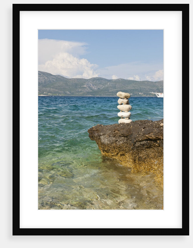 Stack of pebbles on cliff, Lumbarda, Korcula island, Croatia by Anonymous