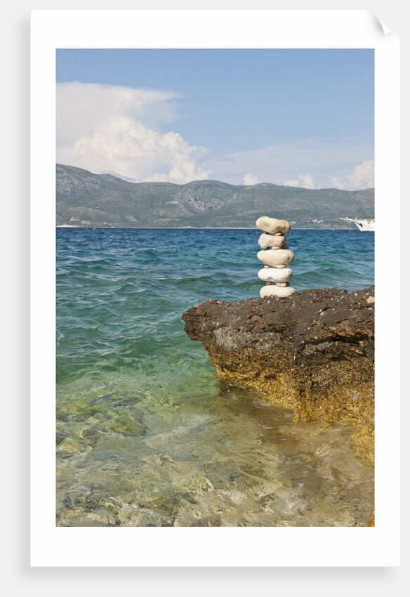 Stack of pebbles on cliff, Lumbarda, Korcula island, Croatia by Anonymous