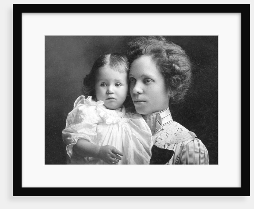 Young mother with her toddler son, ca. 1913 by Anonymous