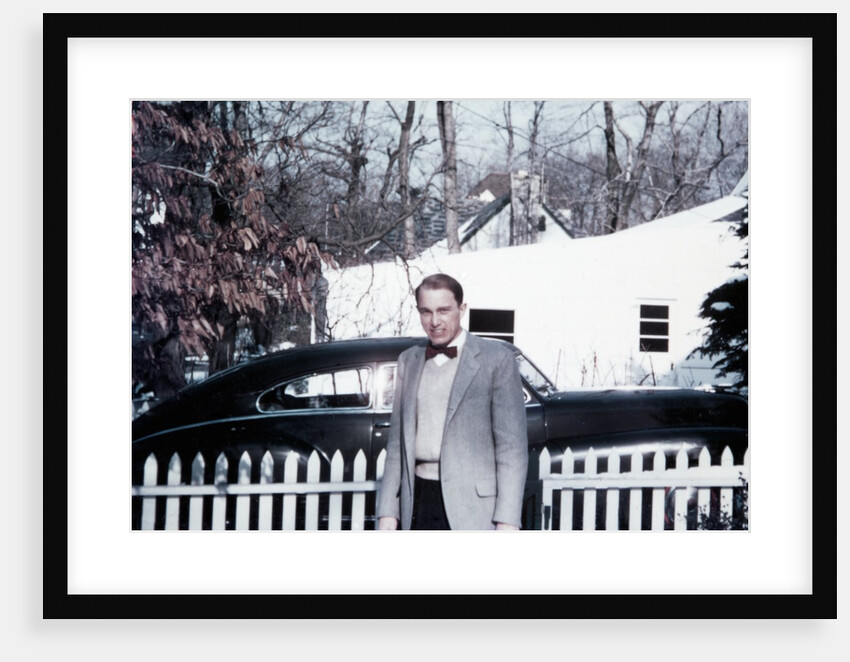 Mature man in front of 1940s car, ca. 1950 by Anonymous