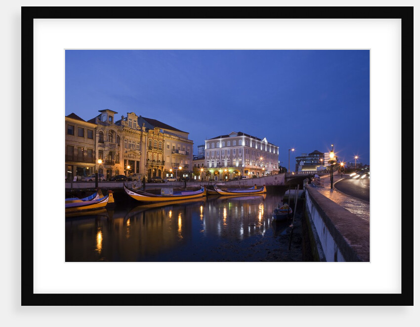 Moliceiro boats docked by Art Nouveau style buildings along the Central Canal by Anonymous