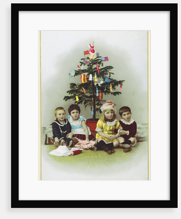 Four children sitting in front of Christmas Tree by Anonymous