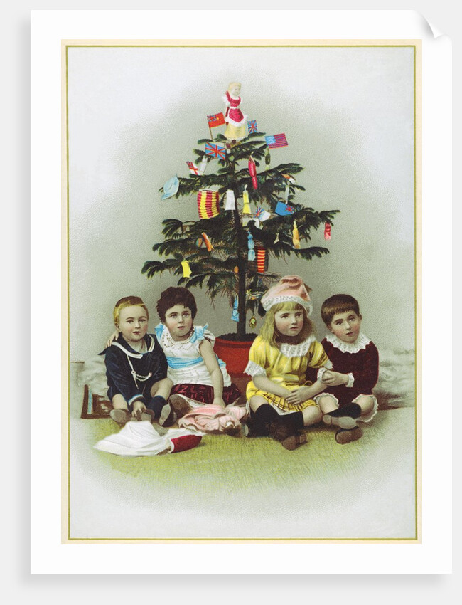Four children sitting in front of Christmas Tree by Anonymous