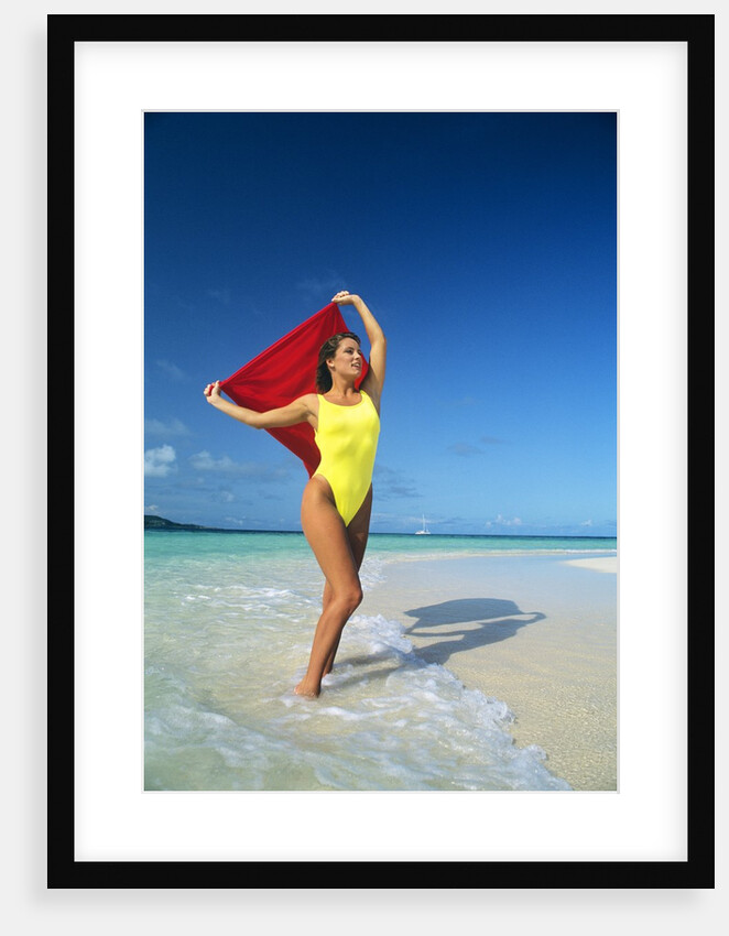 1980s Woman Wearing Yellow Bathing Suit Holding Red Cloth Mopion Island Grenadines West Indies by Anonymous