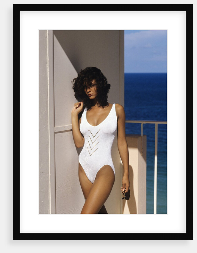 1990s Woman Wearing White Bathing Suit Looking At Camera by Anonymous