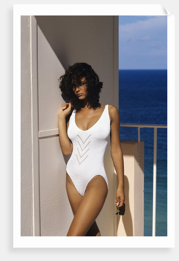 1990s Woman Wearing White Bathing Suit Looking At Camera by Anonymous