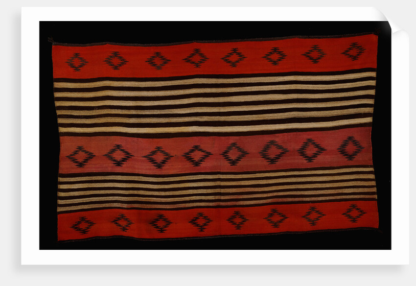 A transitional Navajo woman's blanket by Corbis