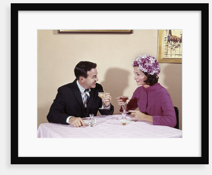 1960s Couple Drinking Cocktails At Table Husband Wife Indoor by Anonymous