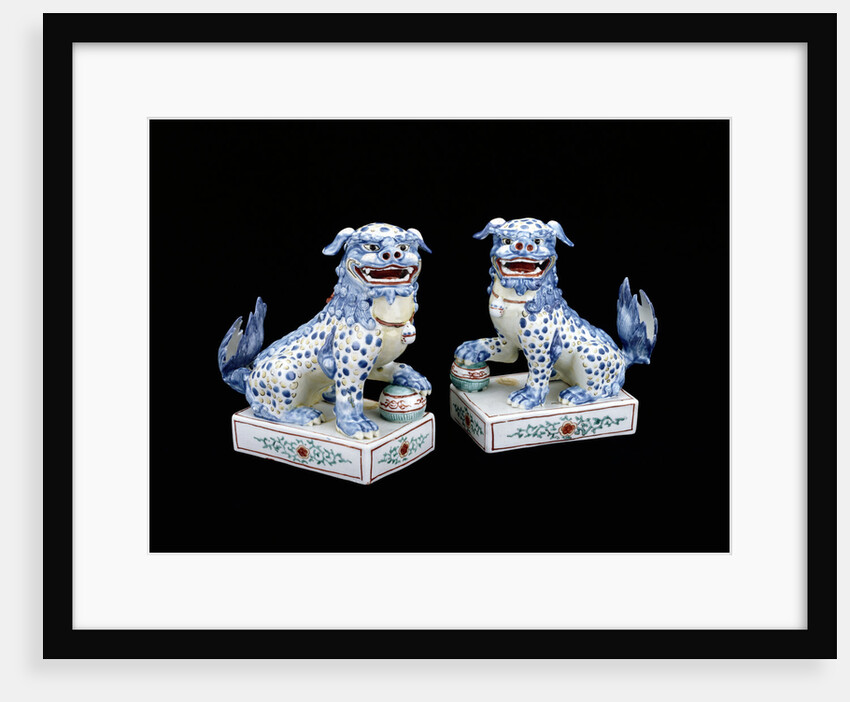 A pair of Kakiemon models of seated Karashishi by Anonymous