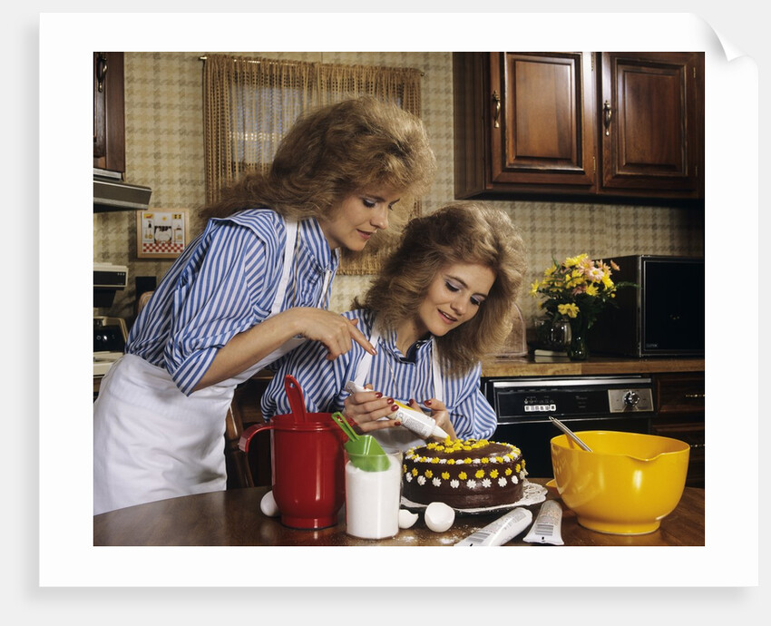 1970s Mother Daughter Dressed Alike Decorating Cake by Anonymous
