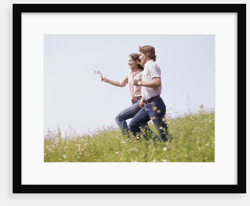 1970s Couple Running Holding Hands Field by Anonymous