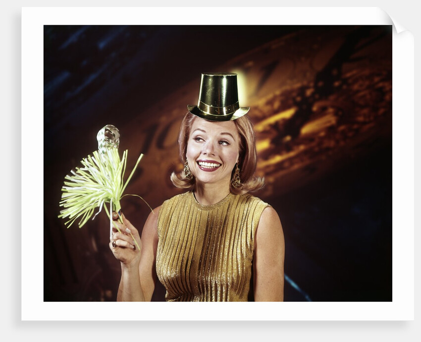1960s Young Blonde Woman Party Hat Noisemaker Horn Smiling New Year Clock Background by Anonymous