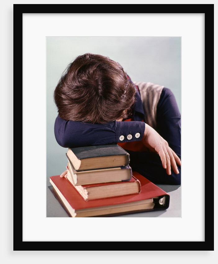 1960s 1970s Female Student Head Down On Pile Of Books Asleep Exhausted by Anonymous