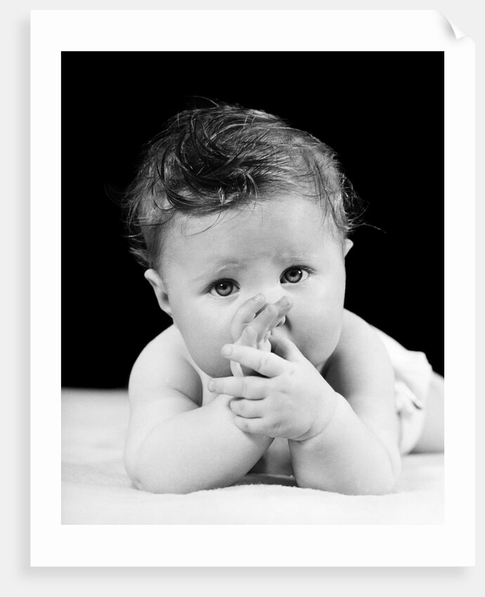 1940s Cute Baby Sucking Thumb Looking At Camera by Anonymous