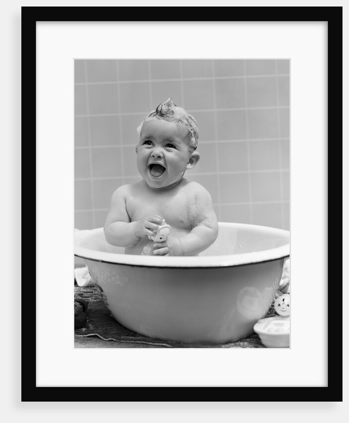 1940s Smiling Baby In Bath Covered In Soap Suds Laughing Holding Toy by Anonymous