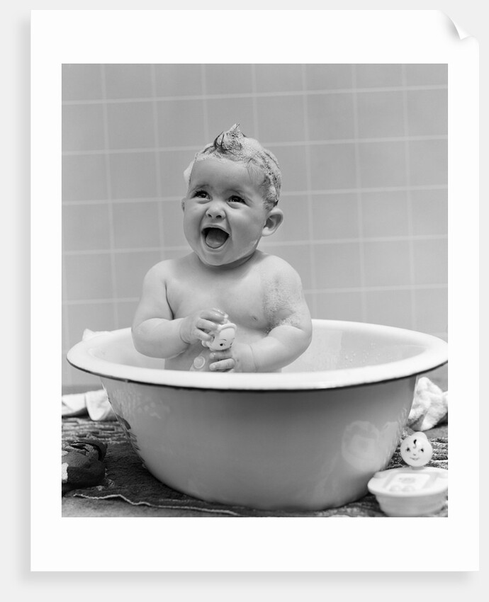 1940s Smiling Baby In Bath Covered In Soap Suds Laughing Holding Toy by Anonymous
